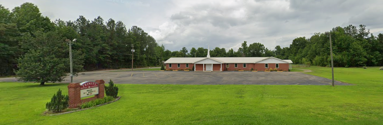 Trinity Petal’s brick church building, steeple, front entrance, and parking lot at 53 Corinth Road